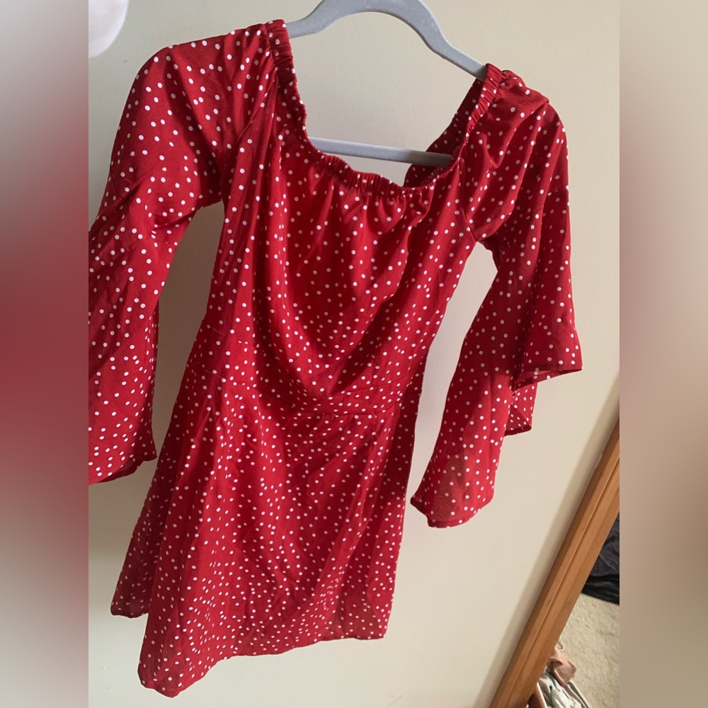 Adorable red poka-dot dress like new. Zipper back tapered waist